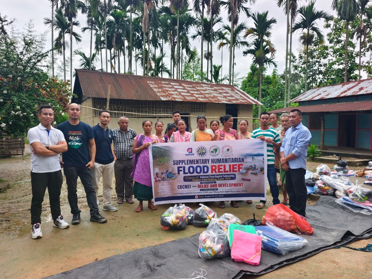 KABC, partner representatives, community members, and relief materials at Kaibong Tisso Village.