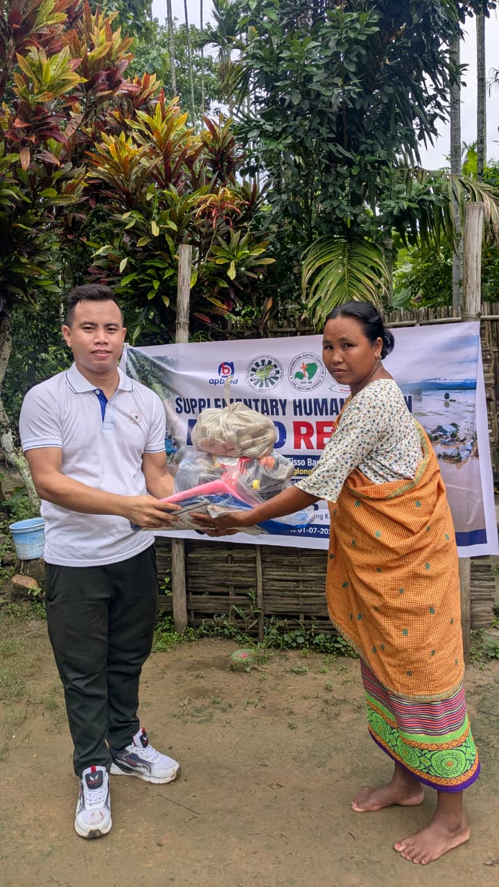 Relief supplies being received during the Kaibong Tisso Village flood-relief distribution.